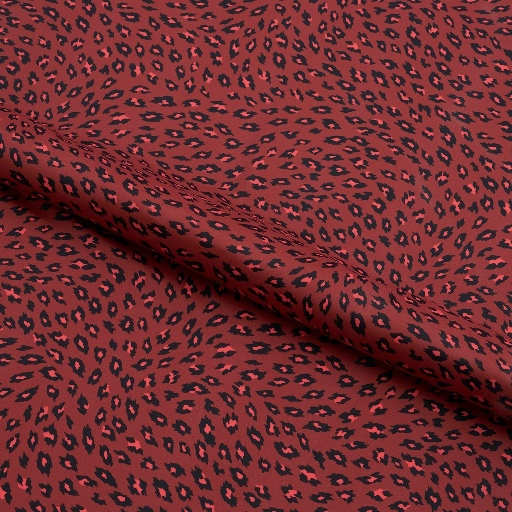 NT1947 - Black on Red Cheetah Printed Spandex Fabric | Blue Moon Fabrics